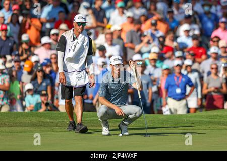 Joel Stock Caddie For Will Zalatoris Raises A Club On The Ninth Green joel-stock-caddie-for-will-zalatoris-raises-a-club-on-the-ninth-green