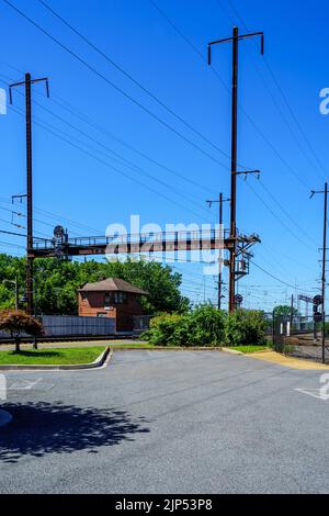 Perryville, MD, USA – August 13, 2022: Electrified railroad tracks at the MARC Rail Station. Stock Photo