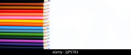 A set of colored pencils isolated on a white background in banner format. Place for text Stock Photo