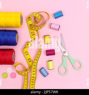 Sewing supplies and asccessories on pastel pink background. Flat lay. Creative leisure concept Stock Photo