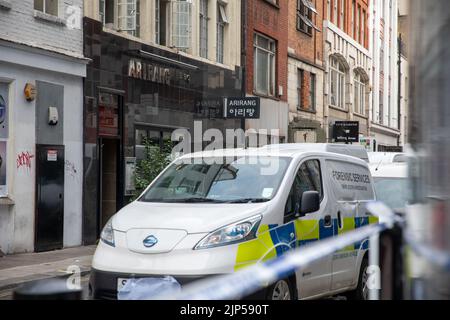 Poland Street, London on 15th August 2022, Forensic services outside Arirang Restaurant as a man was stabbed to death in Poland Street, London on 15th August 2022 Stock Photo