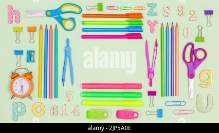 Pastel green background with copy space and Back to school stationery. Flat lay Stock Photo