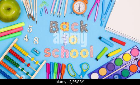 Back to school background with text and school stationery around. Flat lay Stock Photo