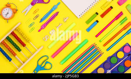 Back to school pattern made with school stationery on vibrant yellow background. Flat lay Stock Photo