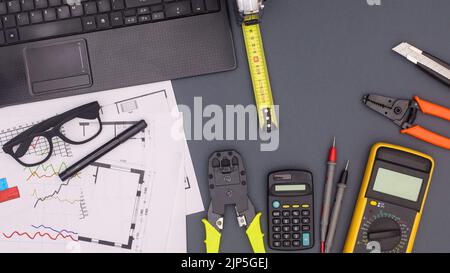 Business and architecture table with plans and construction tools. Flat lay Stock Photo