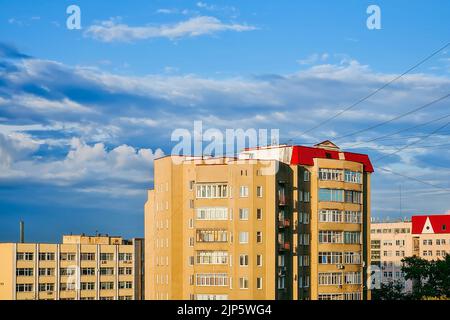 Residential high-rise houses. Aerial view of  buildings in suburbs against blue sky. Stock Photo