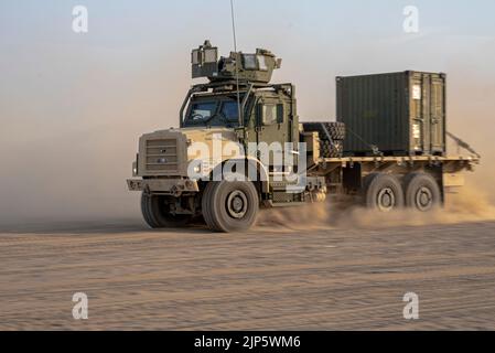 A U.S. Marine Corps AMK23 cargo truck moves with a convoy inside a Logistics Support Area established in the Kingdom of Saudi Arabia during exercise Native Fury 22, Aug. 14, 2022. Native Fury 22 is vital for strengthening the United States’ long-standing relationship with Saudi Arabian Armed Forces. The Exercise enhances combined tactics, maritime capabilities and promotes long-term regional stability. (U.S. Marine Corps Photo by Cpl. Patrick Katz) Stock Photo