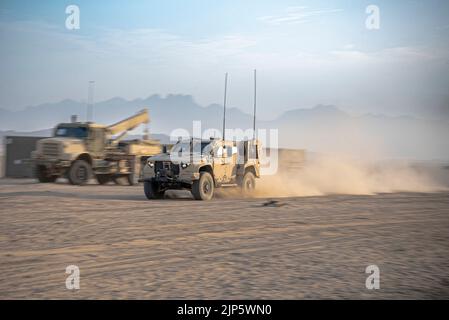 A U.S. Marine Corps Joint Light Tactical Vehicle departs a Logistics Support Area established in the Kingdom of Saudi Arabia with a convoy during exercise Native Fury 22, Aug. 14, 2022. Native Fury 22 is vital for strengthening the United States’ long-standing relationship with Saudi Arabian Armed Forces. The Exercise enhances combined tactics, maritime capabilities and promotes long-term regional stability. (U.S. Marine Corps Photo by Cpl. Patrick Katz) Stock Photo