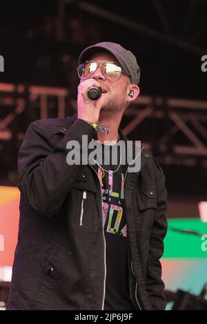 Winchester, UK. 14th Aug, 2022. Reggae artist Collie Buddz (born Colin Patrick Harper) performs live on the Grand Central Stage at the Boomtown Fair Festival. Boomtown is a British music festival held every year on the Matterley Estate in South Downs National Park, near Winchester. Credit: SOPA Images Limited/Alamy Live News Stock Photo