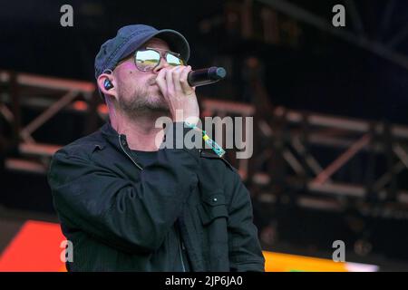 Winchester, UK. 14th Aug, 2022. Reggae artist Collie Buddz (born Colin Patrick Harper) performs live on the Grand Central Stage at the Boomtown Fair Festival. Boomtown is a British music festival held every year on the Matterley Estate in South Downs National Park, near Winchester. Credit: SOPA Images Limited/Alamy Live News Stock Photo