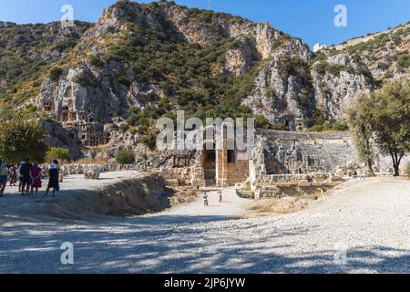 Demre, Antalya Turkey - October 03 2021: Ancient theater at Myra ancient city. Rock-cut tombs Ruins in Lycia region. Stock Photo