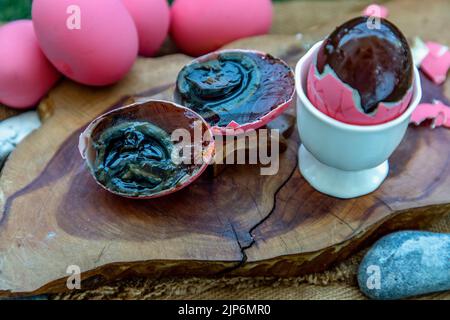 Asian Traditional Food, Pink Century eggs (Pidan Eggs) also known as preserved egg, hundred-year egg, thousand-year egg are a Chinese preserved food p Stock Photo