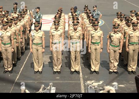 Indonesian navy cadets and officers lining up for a ceremony and briefing, as KRI Dewaruci (Dewa Ruci), an Indonesian tall ship, is opened for public visitors at Kolinlamil harbour (Navy harbour) in Tanjung Priok, North Jakarta, Jakarta, Indonesia. Stock Photo