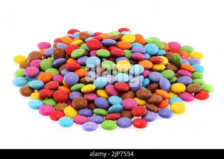 Heap of multi coloured halloween candy sweets on white Stock Photo