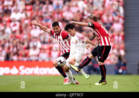 BILBAO, SPAIN - AUGUST 15: Kang in Lee of RCD Mallorca competes for the ball with Yuri Berchiche and Iker Muniain of Athletic Club during the La Liga Santander match between Athletic Club and RCD Mallorca on August 15, 2022 at San Mames in Bilbao, Spain. Credit: Ricardo Larreina/AFLO/Alamy Live News Stock Photo