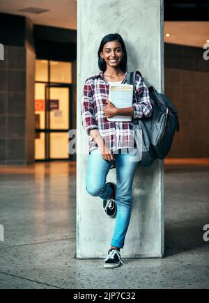 Be confident in your college life. a young female student outside on campus. Stock Photo