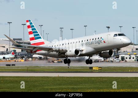 An American Eagle (Republic Airways) Embraer 170-200LR landing at Montreal Pierre Elliott Trudeau International Airport. Republic Airways Inc is a regional airline that operates services as American Eagle, Delta Connection, and United Express using a fleet of Embraer 170 and Embraer 175 regional jets. It is headquartered in Indianapolis, Indiana. Stock Photo