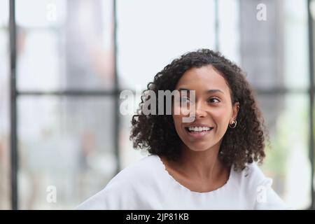 Happy business woman smiling inside office building Stock Photo