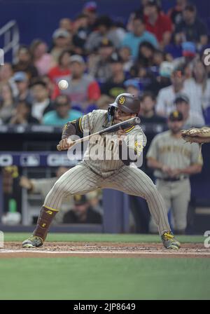 Miami, FL. USA;  San Diego Padres center fielder Trent Grisham (2) bunts during a MLB game against the Miami Marlins, Monday, August 15, 2022, at Loan Stock Photo