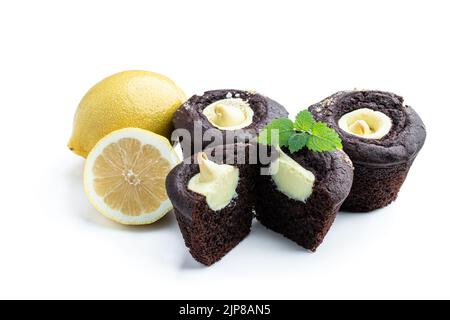 Chocolate  muffins with lemon cream filling isolated on white Stock Photo