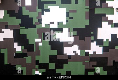 Military camouflage pattern green, greens, black, white and brown patches Stock Photo