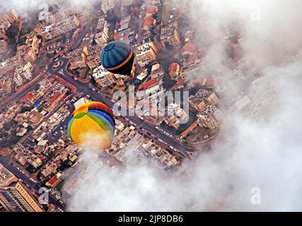 Hot Air Balloon floats in the air as seen from above Stock Photo