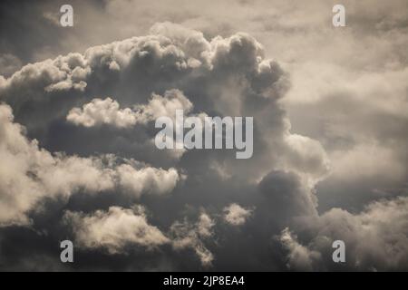 Sunset beautiful clouds on the dramatic stormy sky background before the rain. Dark stormy sky texture Stock Photo