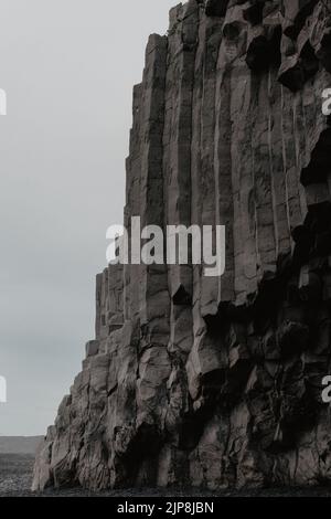 Basalt stone columns on Reynisfjara black beach Stock Photo