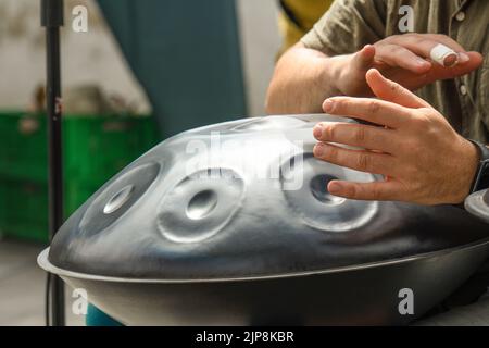 Playing the drum with the hands Stock Photo