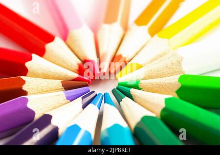 A row of colored pencils on a white background Stock Photo
