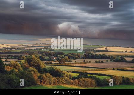 Storm front over summer evening landscape Stock Photo