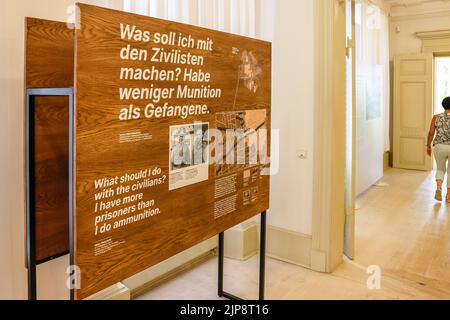 16 August 2022, Schleswig-Holstein, Schleswig: An information board is located in the Schleswig-Holstein State Archives. On August 17, 2022, the exhibition 'Heinz Reinefarth. From Nazi War Criminal to Member of the State Parliament' will open. Reinefarth was a German lieutenant general in the Waffen SS and was responsible for, among other things, the suppression of the Warsaw Uprising, during which tens of thousands of civilians were shot under his command. Reinefarth was never prosecuted for his actions. He managed to embark on a political career, becoming a member of the Schleswig-Holstein p