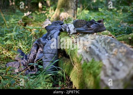 Worn out clothing abandoned by Said, refugee from Congo (DRC) who was wandering in the woods for 4 days avoiding Polish border patrols. Stock Photo