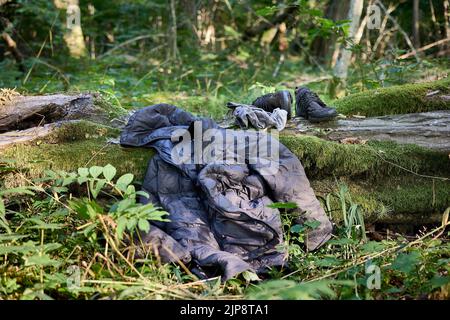 Worn out clothing abandoned by Said, refugee from Congo (DRC) who was wandering in the woods for 4 days avoiding Polish border patrols. Stock Photo