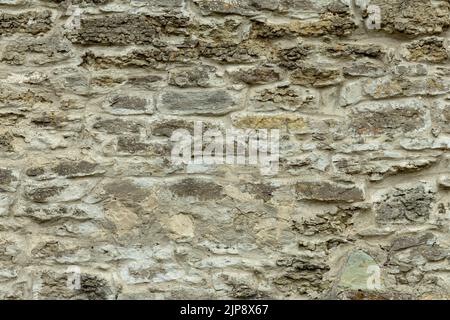 Old gray stone wall. Stone background from gray old stones. Stock Photo