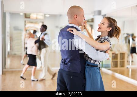 Man and woman learning to dance classical ballroom dance Stock Photo