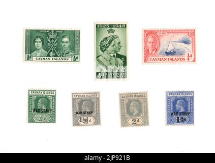 A selection of old mint postage stamps from the Cayman Islands on a white background. Stock Photo