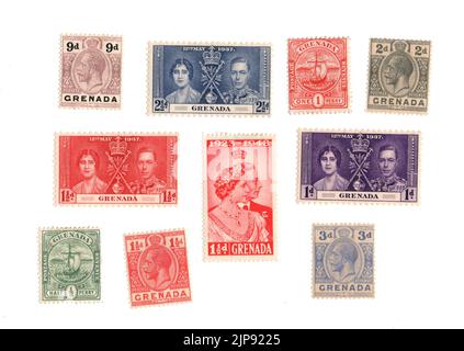 A selection of old mint postage stamps from Grenada on a white background. Stock Photo