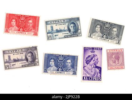 A selection of old mint postage stamps from Cyprus on a white background. Stock Photo