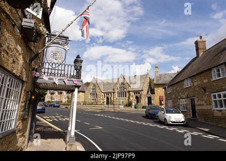Dorset village; the village of Abbotsbury in Dorset, with The Ilchester Arms Hotel and Strangways Hall, South West England, Dorset UK Stock Photo