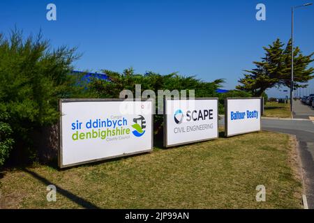 Rhyl, UK: Aug 11, 2022: Three wood framed signs at the entrance to a temporary works depot. Stock Photo