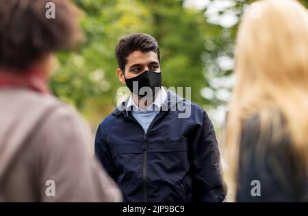indian man in reusable mask at park Stock Photo