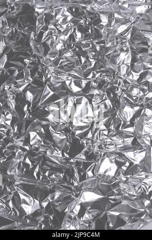 Abstract background of crumpled silver aluminium foil Stock Photo