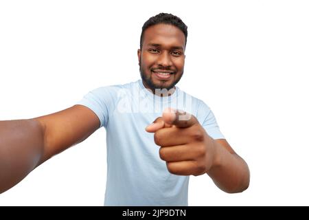 smiling young african american man taking selfie Stock Photo