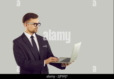 Serious businessman work on laptop Stock Photo
