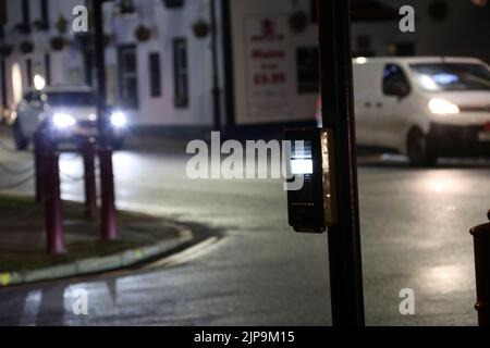 Prestwick Cross, Main Street, Prestwick, Ayrshire, Scotland, UK. Night time photos showing Pelican crossing with light trails. Close up of push button Stock Photo