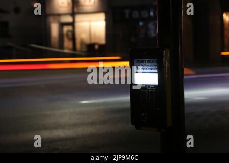 Prestwick Cross, Main Street, Prestwick, Ayrshire, Scotland, UK. Night time photos showing Pelican crossing with light trails. Close up of push button Stock Photo