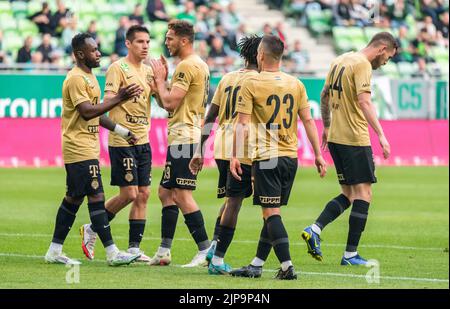 BUDAPEST, HUNGARY - MAY 4: Ihor Kharatin of Ferencvarosi TC #14 blocks the  shot from Vincent Onovo of Ujpest FC (l) before Tokmac Chol Nguen of Ferencvarosi  TC #92 during the Hungarian