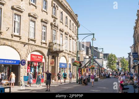 People walking through Buxton town centre, Derbyshire, England, UK Stock Photo