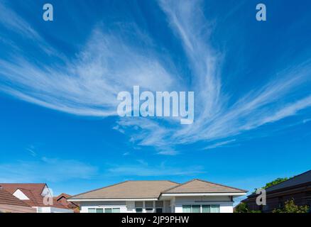 The roof of the house is in the weather on a sunny day with a clear sky. Stock Photo